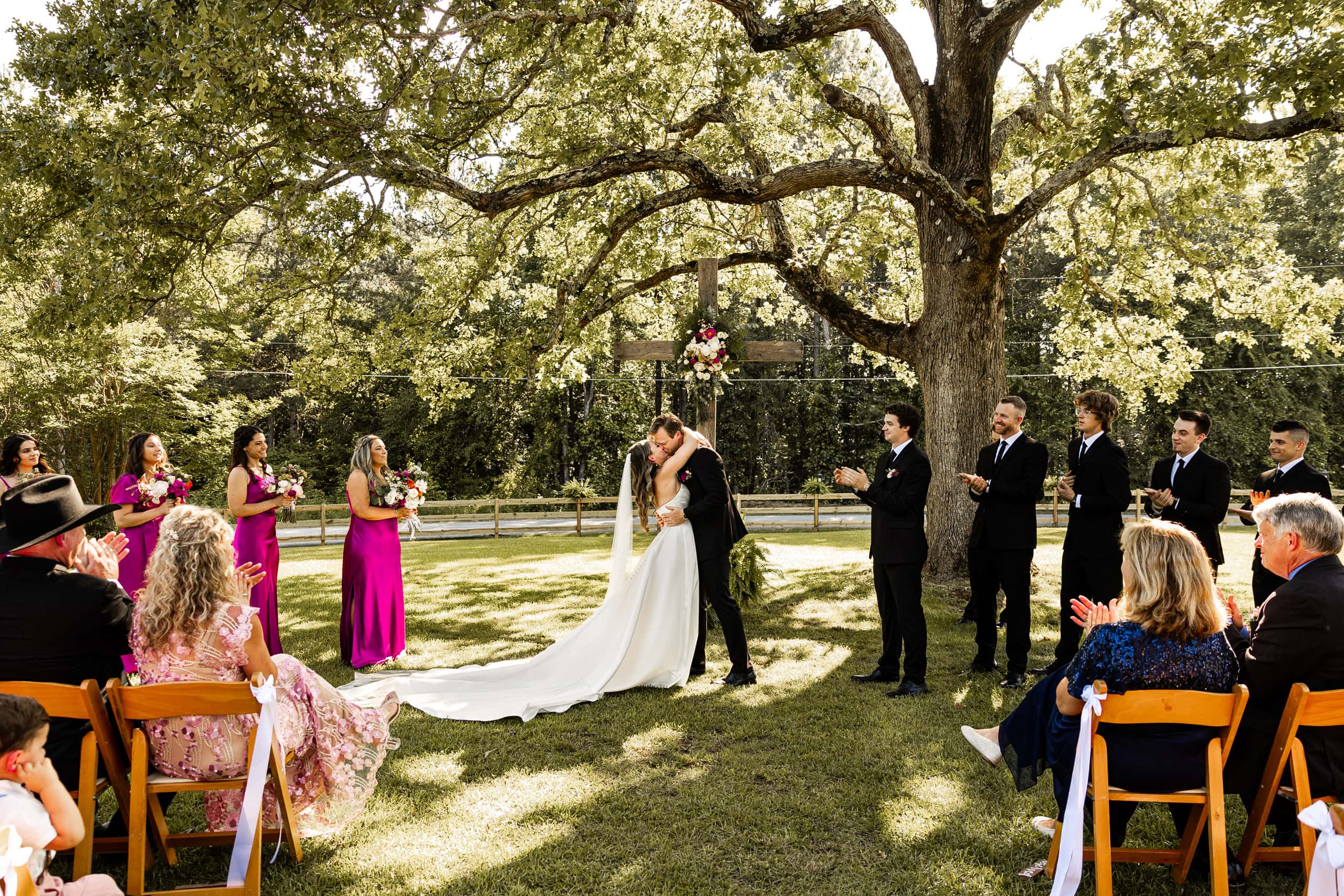 Romantic moment when Andrew kisses Alyssa during the ceremony, sealing their vows with love and joy.